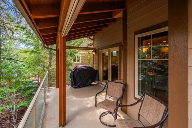 view of patio featuring a balcony and area for grilling