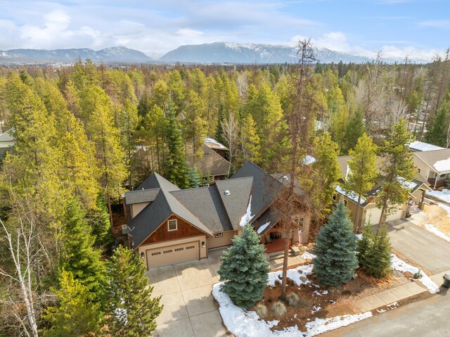 bird's eye view featuring a mountain view and a forest view