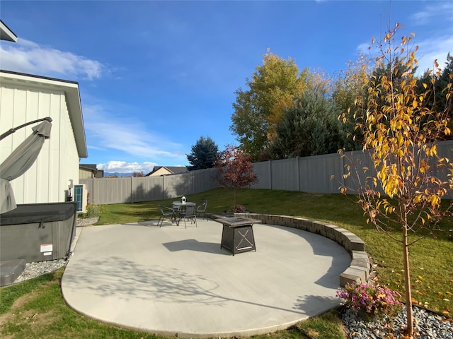 view of patio / terrace featuring cooling unit, a fire pit, a fenced backyard, and a hot tub