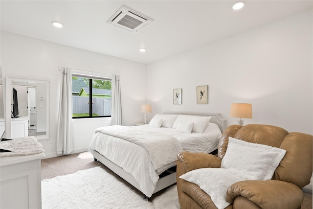 bedroom featuring baseboards, recessed lighting, visible vents, and light carpet