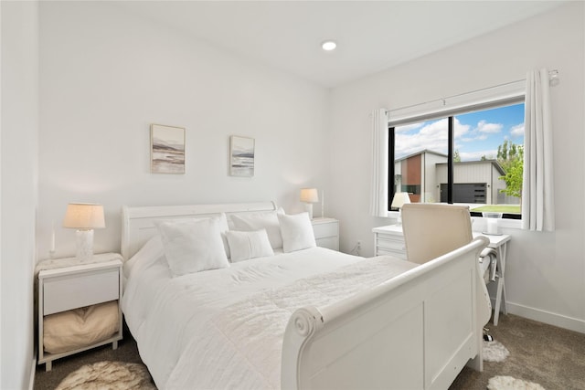 bedroom featuring baseboards and carpet