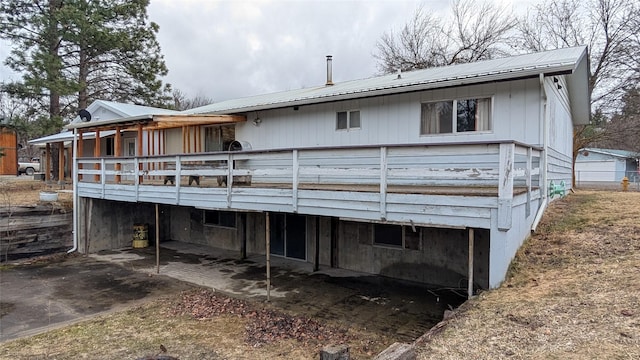 rear view of house with metal roof