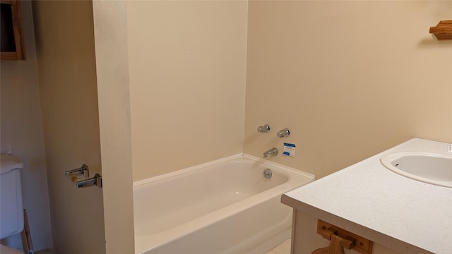 bathroom featuring vanity and a bath