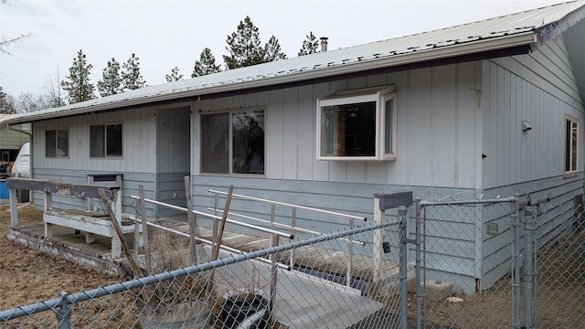 view of side of property featuring metal roof