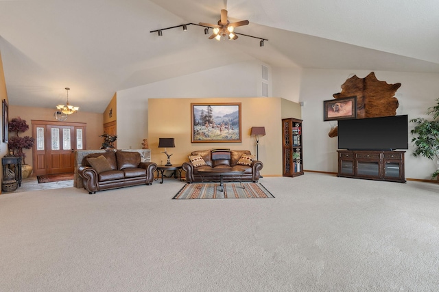 carpeted living area with baseboards, a notable chandelier, and high vaulted ceiling