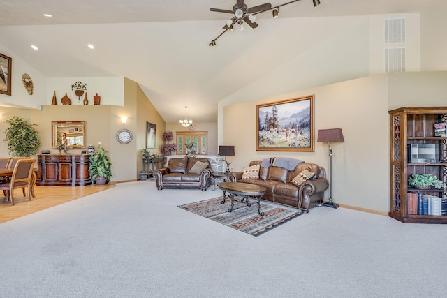 living area with light carpet, recessed lighting, high vaulted ceiling, and baseboards