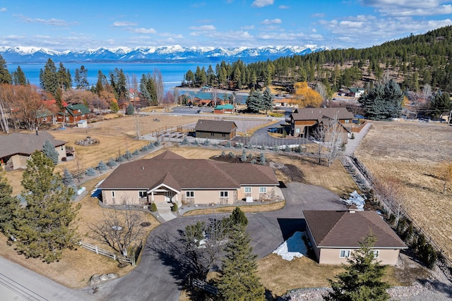 birds eye view of property with a mountain view