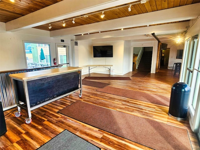 interior space with beamed ceiling, wooden ceiling, stairs, and wood finished floors