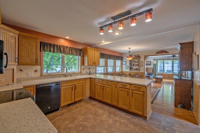 845 S California St, Helena, MT 59601 - kitchen featuring black dishwasher, a peninsula, backsplash, hanging light fixtures, and recessed lighting