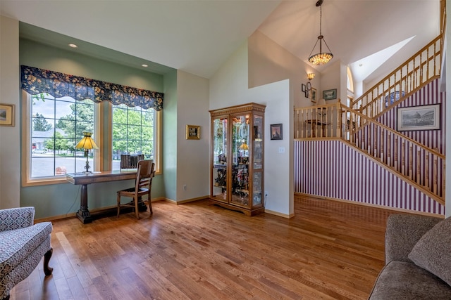 845 S California St, Helena, MT 59601 - entrance foyer featuring wood finished floors, baseboards, stairway, high vaulted ceiling, and recessed lighting