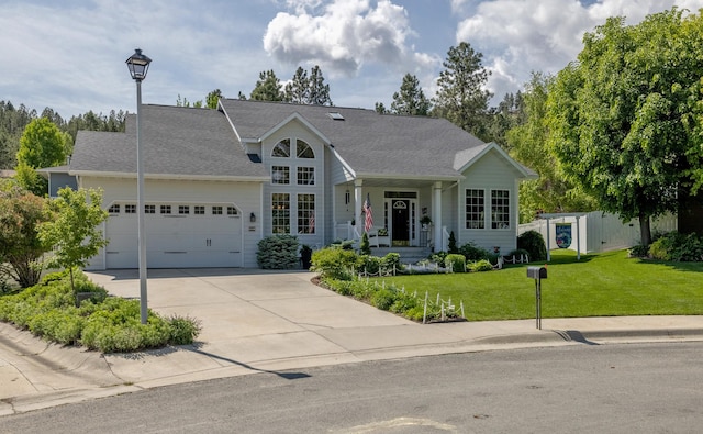 845 S California St, Helena, MT 59601 - view of front of home featuring an attached garage, concrete driveway, a front yard, and a porch