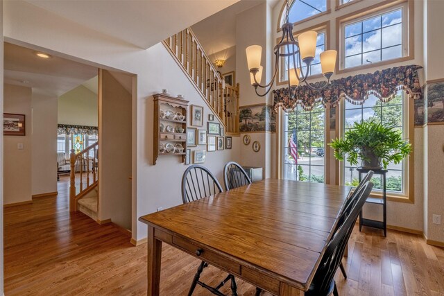 845 S California St, Helena, MT 59601 - dining room featuring stairs, light wood finished floors, and a chandelier