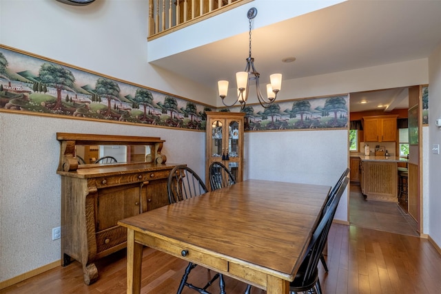 845 S California St, Helena, MT 59601 - dining room featuring wood-type flooring and a chandelier