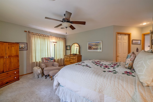 carpeted bedroom with a ceiling fan