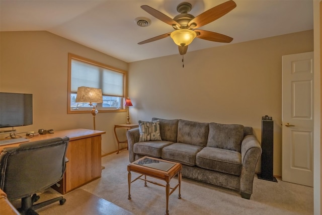 home office featuring vaulted ceiling, a ceiling fan, and visible vents