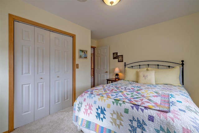 carpeted bedroom with a closet