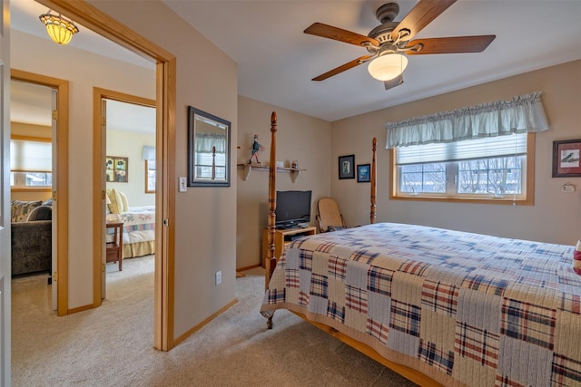 bedroom featuring baseboards and light carpet