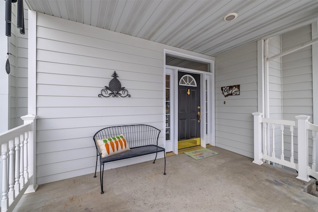 entrance to property featuring a porch