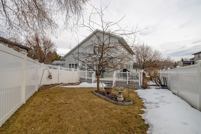 view of yard with a deck and a fenced backyard