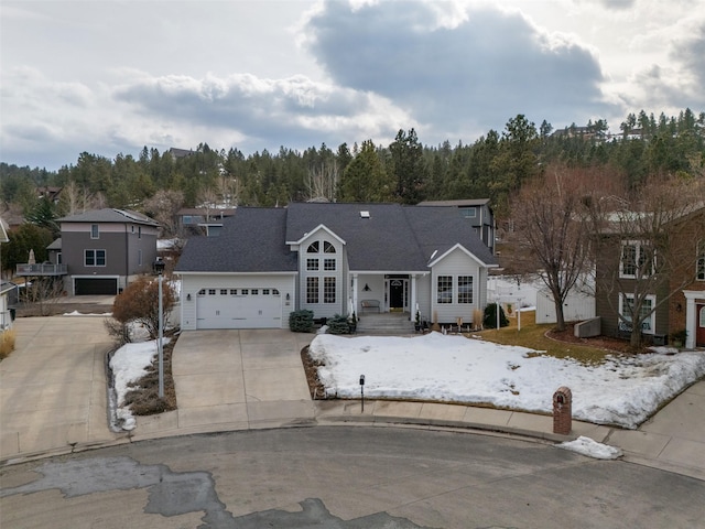 traditional-style home with an attached garage and driveway