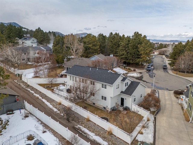 birds eye view of property with a mountain view and a residential view