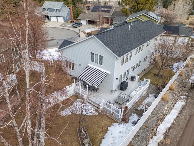 snowy aerial view featuring a residential view