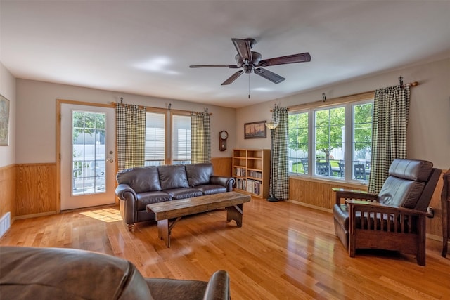 845 S California St, Helena, MT 59601 - living area with wainscoting, wood finished floors, ceiling fan, and wood walls
