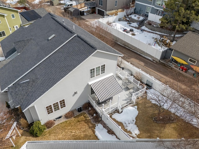 snowy aerial view featuring a residential view