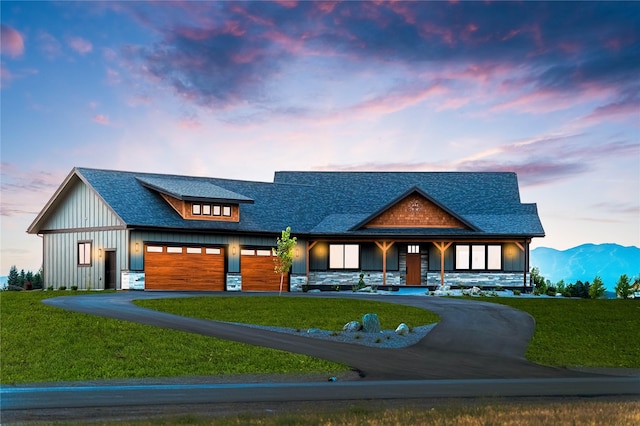 modern farmhouse featuring a front yard and driveway