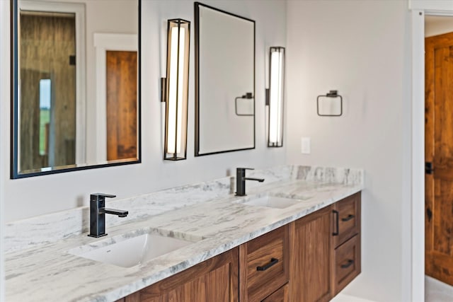 bathroom with double vanity and a sink