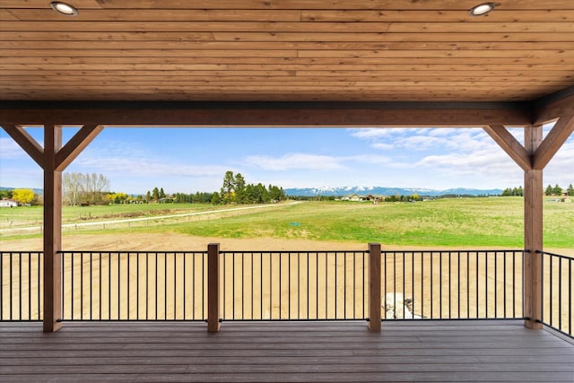 wooden deck with a rural view