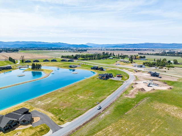 birds eye view of property with a mountain view