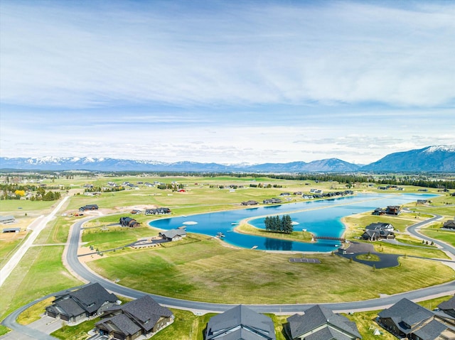 birds eye view of property featuring a water and mountain view