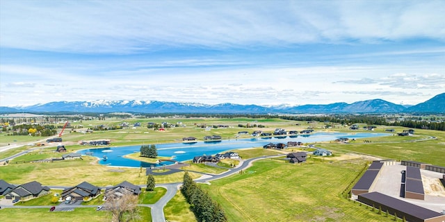 bird's eye view with a water and mountain view