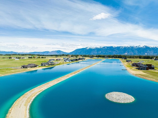 bird's eye view with a water and mountain view