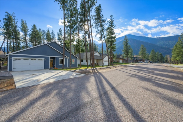 view of road featuring a residential view and a mountain view