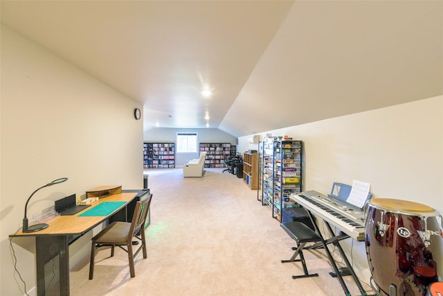 office space featuring light colored carpet and vaulted ceiling