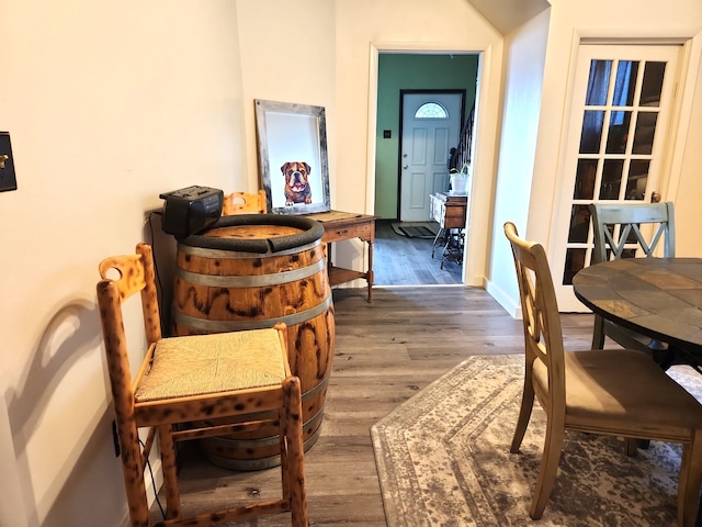 dining area with wood finished floors