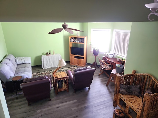 living area featuring wood finished floors and a ceiling fan