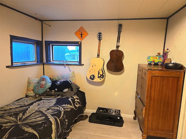 bedroom featuring wood finished floors