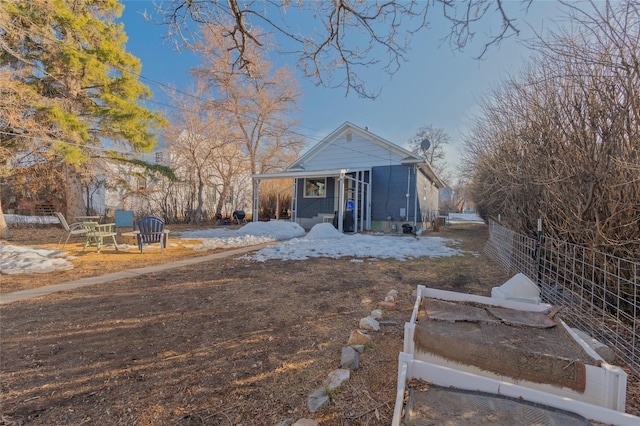 back of house featuring fence