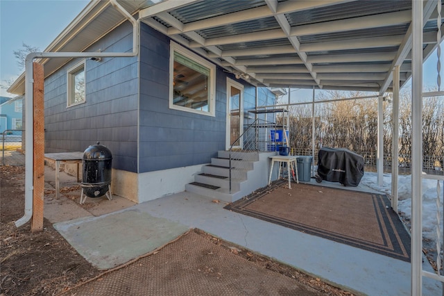 view of patio featuring a grill