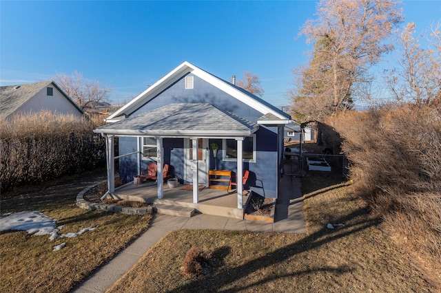 bungalow-style house featuring a shingled roof