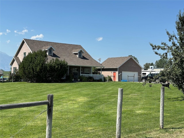 cape cod house with a front lawn, fence, and roof with shingles