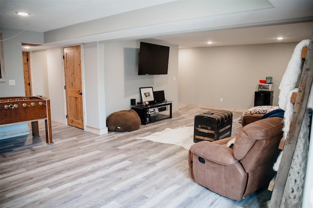 living area featuring recessed lighting, wood finished floors, and baseboards