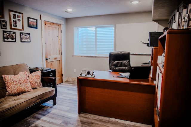 office area featuring wood finished floors and baseboards