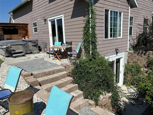 view of patio / terrace featuring a hot tub