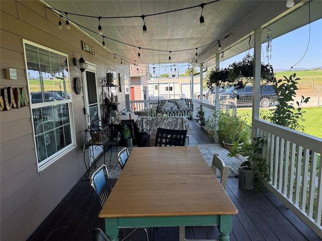 deck with outdoor dining space