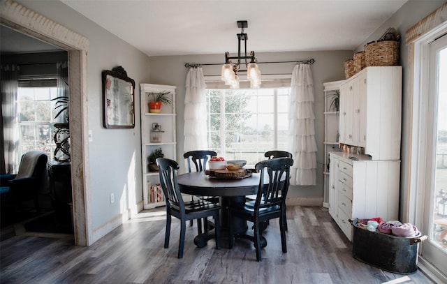 4735 Drake Ln, Stevensville, MT 59870 - dining room with an inviting chandelier, baseboards, and wood finished floors
