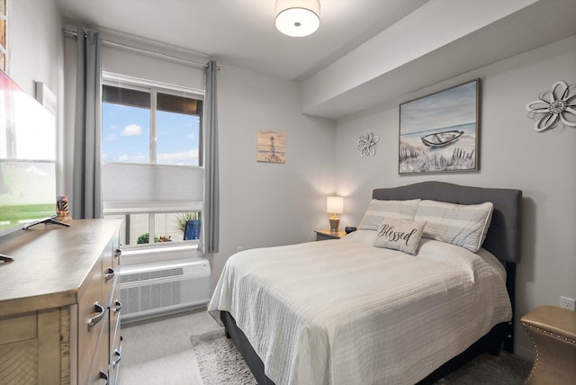 bedroom with light carpet and a wall mounted air conditioner